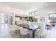 Open-concept dining area with modern table and chairs, next to the living room and kitchen at 14445 N Valencia Dr, Fountain Hills, AZ 85268