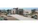 Modern home with neutral stucco, desert landscaping, and stylish garage door at 14445 N Valencia Dr, Fountain Hills, AZ 85268