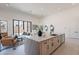 Bright kitchen with a waterfall island, stainless appliances, and an open concept layout to the living area at 14445 N Valencia Dr, Fountain Hills, AZ 85268