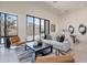 Bright living room with modern decor, comfortable seating, and sliding glass doors to the outdoor space at 14445 N Valencia Dr, Fountain Hills, AZ 85268