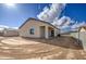 An expansive dirt backyard offering plenty of potential for landscaping and recreation at 14951 S Capistrano Rd, Arizona City, AZ 85123
