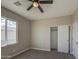 Bedroom with carpeted floors and a closet with doors for easy storage at 14951 S Capistrano Rd, Arizona City, AZ 85123