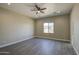 Spacious bedroom with hardwood floors and modern ceiling fan at 14951 S Capistrano Rd, Arizona City, AZ 85123