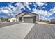 Charming single-story home featuring desert landscaping, neutral paint, and an attached two-car garage at 14951 S Capistrano Rd, Arizona City, AZ 85123