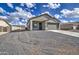 Charming single-story home featuring a two-car garage and low-maintenance gravel landscaping at 14951 S Capistrano Rd, Arizona City, AZ 85123