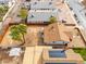 An aerial view shows a fenced backyard, adjacent to a home with solar panels at 1514 E Fillmore St, Phoenix, AZ 85006