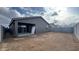 View of backyard, including a covered patio and fence, providing outdoor living and privacy at 15760 W Beryl Ave, Waddell, AZ 85355