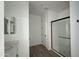 Beautiful bathroom featuring tile floors, vanity with sink and walk in shower with glass doors at 15760 W Beryl Ave, Waddell, AZ 85355