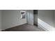 Bedroom features a window for natural light, carpet and a closet with shelving for organization at 15760 W Beryl Ave, Waddell, AZ 85355