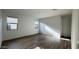 Bright bedroom with modern wood flooring, light walls, two windows and neutral blinds at 15760 W Beryl Ave, Waddell, AZ 85355