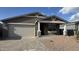 Charming single-story home featuring a two-car garage and desert landscaping at 15760 W Beryl Ave, Waddell, AZ 85355