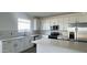 Kitchen featuring stainless steel appliances, granite countertops, and white cabinets at 15760 W Beryl Ave, Waddell, AZ 85355
