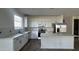 Kitchen featuring stainless steel appliances, granite countertops, and white cabinets at 15760 W Beryl Ave, Waddell, AZ 85355