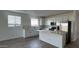 Kitchen featuring stainless steel appliances, granite countertops, and white cabinets at 15760 W Beryl Ave, Waddell, AZ 85355