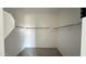 Spacious walk-in closet featuring carpet and shelving for optimum clothing and accessories organization at 15760 W Beryl Ave, Waddell, AZ 85355