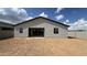 Spacious backyard featuring a blank slate with dirt and minimal landscaping against the home's rear exterior at 15765 W Cheryl Dr, Waddell, AZ 85355