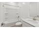 Well-lit bathroom includes shower-tub combo, a single sink and neutral surfaces at 15765 W Cheryl Dr, Waddell, AZ 85355