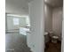 Modern half bathroom features sleek fixtures and wood-look flooring at 15765 W Cheryl Dr, Waddell, AZ 85355