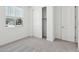 A clean bedroom with neutral walls, carpet, a closet and a window at 15765 W Cheryl Dr, Waddell, AZ 85355