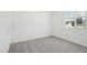 A tidy and neutral bedroom with carpet, white walls and a window at 15765 W Cheryl Dr, Waddell, AZ 85355