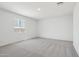 Bright bedroom featuring carpeted floor and a window at 15765 W Cheryl Dr, Waddell, AZ 85355