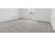 Bright bedroom featuring carpeted floor and a window at 15765 W Cheryl Dr, Waddell, AZ 85355
