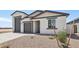 Inviting single-Gathering home featuring a three-car garage and low-maintenance landscaping at 15765 W Cheryl Dr, Waddell, AZ 85355