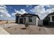 A well-maintained single-Gathering home with desert landscaping and a side view of the property at 15765 W Cheryl Dr, Waddell, AZ 85355
