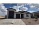 Charming single-story home featuring a two-car garage and inviting desert landscaping at 15765 W Cheryl Dr, Waddell, AZ 85355