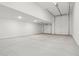 Spacious three car garage featuring recessed lighting and auto garage doors at 15765 W Cheryl Dr, Waddell, AZ 85355