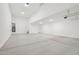 Spacious three car garage featuring recessed lighting at 15765 W Cheryl Dr, Waddell, AZ 85355