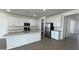 Bright kitchen featuring white cabinetry, stainless steel appliances, and center island at 15765 W Cheryl Dr, Waddell, AZ 85355