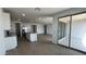 Open kitchen with an island and views of the backyard at 15765 W Cheryl Dr, Waddell, AZ 85355