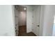 Laundry room view with a washer and dryer, next to an entry door and white trim at 15765 W Cheryl Dr, Waddell, AZ 85355