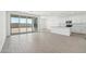 Open floor plan with access to a bright kitchen and sliding doors to a backyard patio at 15765 W Cheryl Dr, Waddell, AZ 85355