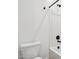A toilet sits next to a bathtub and shower with matte black fixtures at 15778 W Cheryl Dr, Waddell, AZ 85355