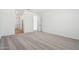 Spacious bedroom with light gray carpet and view of the hallway at 15778 W Cheryl Dr, Waddell, AZ 85355