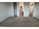 Comfortable bedroom features neutral carpeting and a closet for storage at 15778 W Cheryl Dr, Waddell, AZ 85355