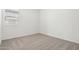 Neutral bedroom featuring soft carpeting, a window with blinds, and white walls at 15778 W Cheryl Dr, Waddell, AZ 85355