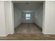 Bright bedroom with neutral carpet and a window for natural light at 15778 W Cheryl Dr, Waddell, AZ 85355