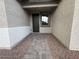 Well-lit entryway leading to the front door with decorative stone walkway at 15778 W Cheryl Dr, Waddell, AZ 85355