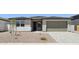 Charming single-story home featuring a low-maintenance desert landscape and a spacious two-car garage at 15778 W Cheryl Dr, Waddell, AZ 85355
