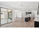 Open-concept kitchen with stainless steel appliances and access to the backyard patio at 15778 W Cheryl Dr, Waddell, AZ 85355