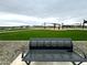 Serene park scene with a comfortable bench offering a relaxing spot to enjoy community green spaces and activities at 15778 W Cheryl Dr, Waddell, AZ 85355