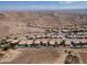 Wide aerial view of desert community homes featuring swimming pools and mountain views at 15825 S 1St Ave, Phoenix, AZ 85045