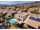 Backyard aerial view featuring private pool, lush green lawns and views of the mountains at 15825 S 1St Ave, Phoenix, AZ 85045