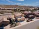 Aerial view of stucco homes in a desert landscape at 15825 S 1St Ave, Phoenix, AZ 85045
