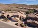Desert homes featuring mature landscaping and tile roofs at 15825 S 1St Ave, Phoenix, AZ 85045