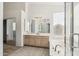 Bathroom featuring a soaking tub with a separate vanity area at 15825 S 1St Ave, Phoenix, AZ 85045