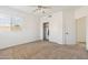 Bedroom with a view, closet with double doors, a large window and neutral carpet flooring at 15825 S 1St Ave, Phoenix, AZ 85045